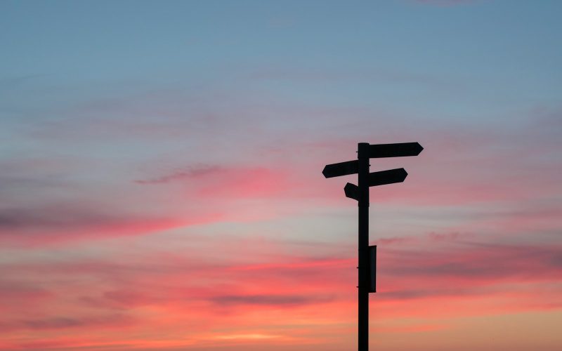 silhouette of road signage during golden hour